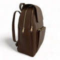 Stylish brown leather women’s backpack with laptop compartment, adjustable straps, and premium handmade design — perfect for work, travel, and everyday use.