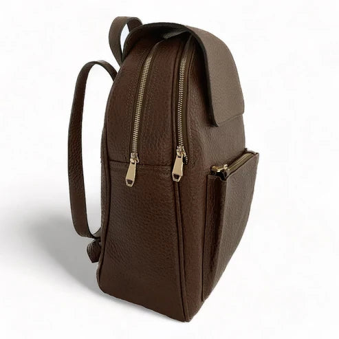 Stylish brown leather women’s backpack with laptop compartment, adjustable straps, and premium handmade design — perfect for work, travel, and everyday use.