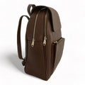 Brown leather women’s backpack with stylish design, premium genuine leather finish, and laptop compartment — perfect for everyday use, work, or travel.