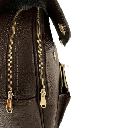 Dark brown genuine leather women's backpack by LeatherLuxe with sleek design, premium finish, and spacious compartments.