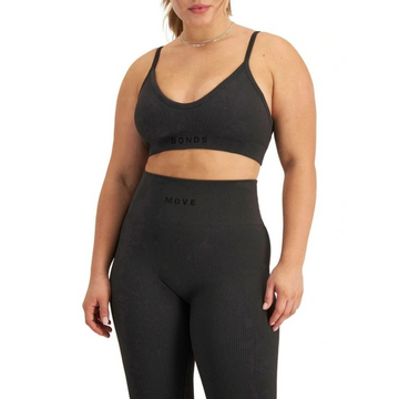 Move Rib Seamless Crop Top in ribbed nylon elastane with removable cups, soft v-neckline, moisture-wicking finish, and supportive underbust elastic