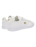 Lacoste Carnaby Pro Leather Sneakers in White/Gold, featuring a sleek leather upper with gold accents for a luxurious, stylish design.