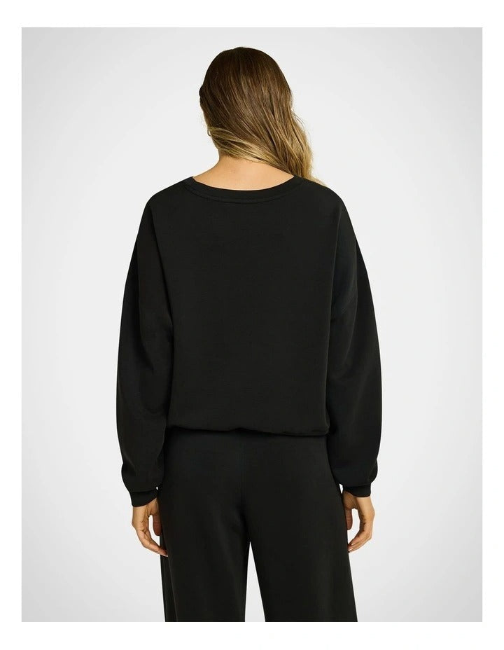 Travel Hip Length Crew Jumper in Black – Front View