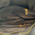 Black genuine leather tote bag with premium craftsmanship, minimalist design, and spacious interior from LeatherLuxe.