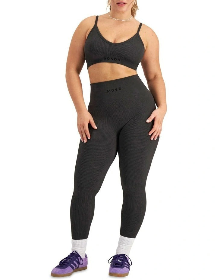 Move Rib Seamless Crop in ribbed nylon elastane with removable cups, soft vee neckline, moisture-wicking finish, and supportive underbust elastic