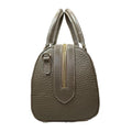 Beige genuine leather barrel shoulder bag with adjustable strap, minimalist design, and premium handcrafted finish.