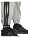 Adidas Essentials 3-Stripes Fleece Loose-Fit Joggers in Grey with soft fleece, loose fit, and iconic 3-Stripes design