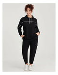 Taking Shape Active Mock Neck Top in Black with cords, ribbed cuffs, thumbholes, and flattering piping detail for plus size comfort and style.
