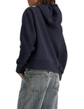 Champion Graphic Hoodie in Deep Navy – Classic pullover hoodie with bold logo print, premium fabric, and relaxed streetwear style.