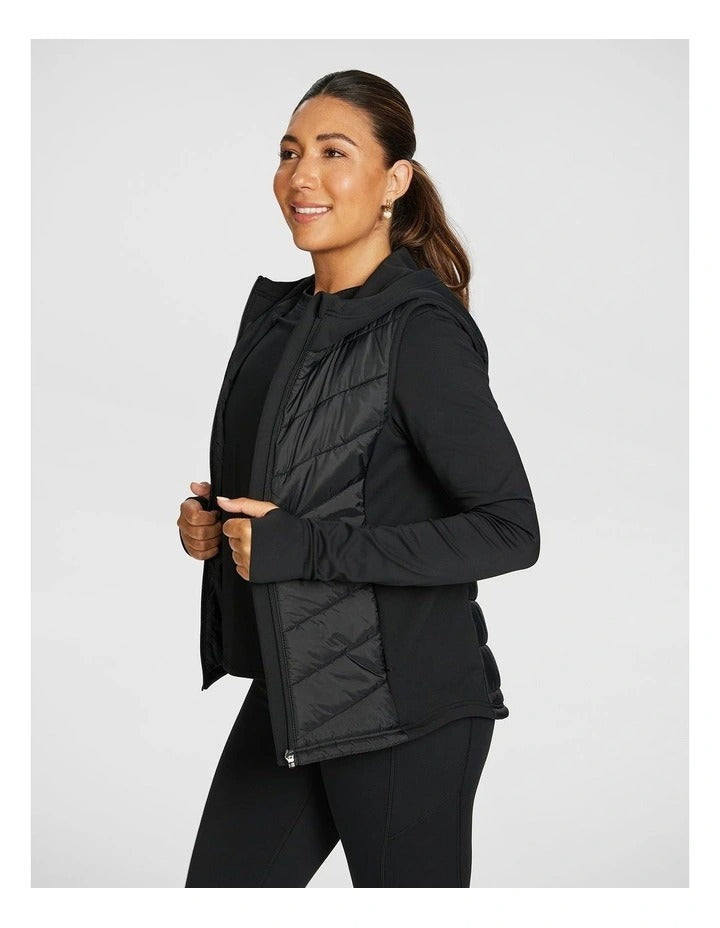 Rockwear Warm All Ways Vest in Black with cozy hood and chevron stitched panels.