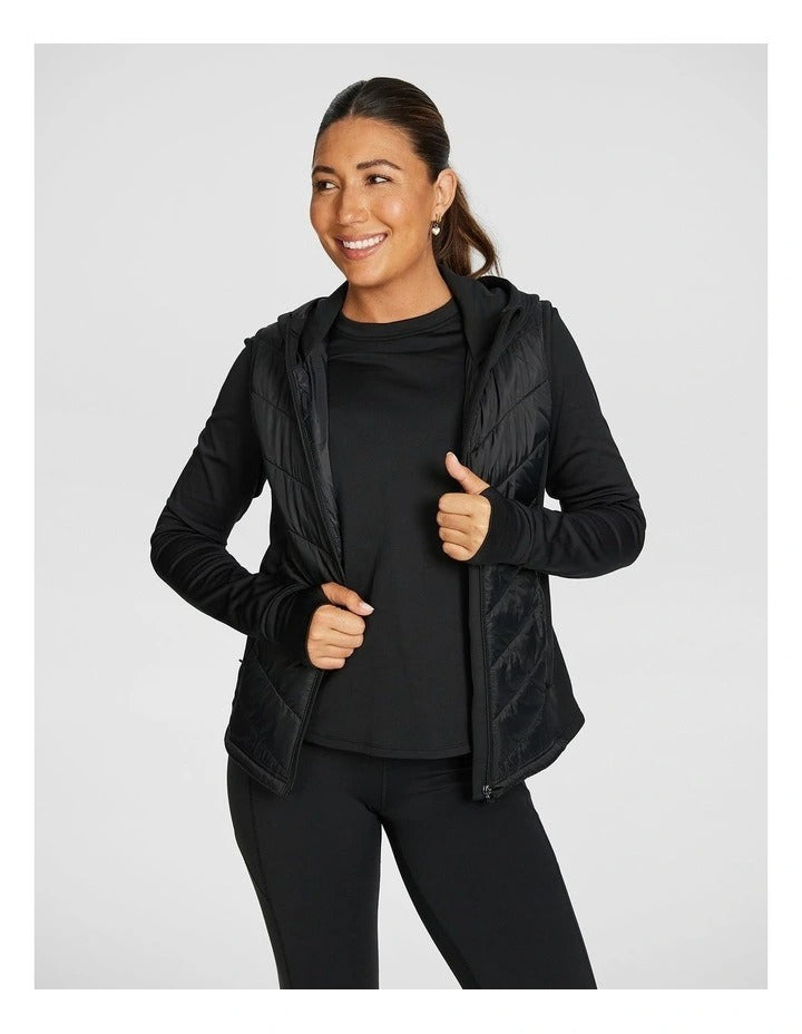 Rockwear Warm All Ways Vest in Black with cozy hood and chevron stitched panels.