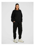 Rockwear Cosy Fleece Longline Crew Sweatshirt in Black offering full coverage and comfort.