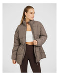 Rockwear Longline Puffer Jacket in Brown, women's full-length puffer jacket with side pockets, padded insulation, and elastic toggle waist for a flattering fit.