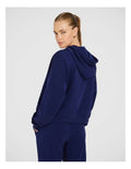 Rockwear Travel Zip Through Hoodie in Blue, featuring a relaxed fit, hip-length silhouette, and side pockets for a cozy, stylish look.