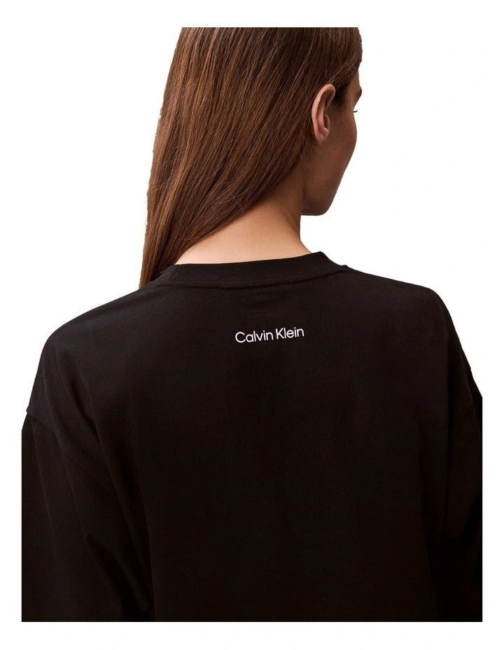 Calvin Klein Jeans oversized black t-shirt with bold logo graphic, boxy silhouette, crew neckline and short sleeves for women