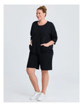 Taking Shape Patch Pocket Sweat in Black – plus size cotton-blend top with oversized front patch pockets, round neckline, and relaxed fit