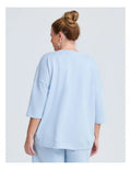 Taking Shape Patch Pocket Sweat in Ice Blue – plus size cotton-blend top with oversized front patch pockets, round neckline, and relaxed fit
