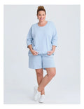 Taking Shape Patch Pocket Sweat in Ice Blue – plus size cotton-blend top with oversized front patch pockets, round neckline, and relaxed fit