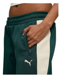 Puma T7 Low Rise Track Pants in black with 7cm signature stripes, elasticated waistband, zipper pockets, and Cat Logo embroidery
