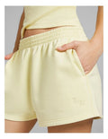Rockwear women’s yellow cosy fleece shorts with relaxed fit, regular rise, and side phone pockets, perfect for lounging or casual wear.