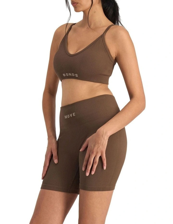 Move Rib Seamless Crop Bra in ribbed stretch fabric with removable cups, soft V-neckline, and supportive underbust elastic for low impact activities
