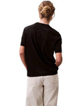 Calvin Klein women’s mock neck top in lyocell cotton blend with ribbed trims, classic fit, and signature logo.