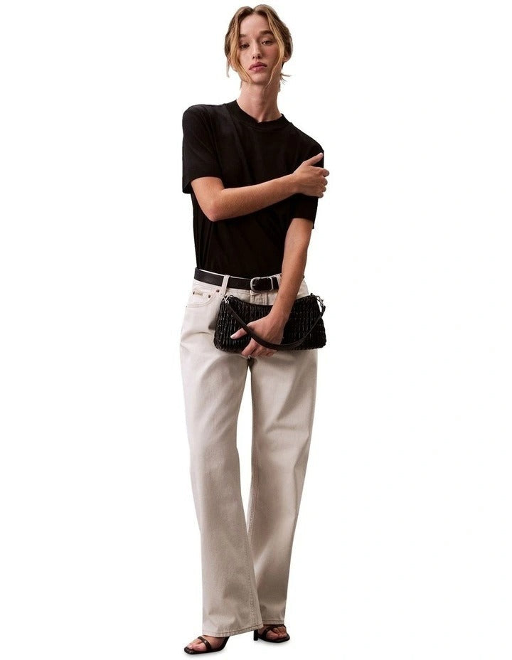 Calvin Klein women’s mock neck top in lyocell cotton blend with ribbed trims, classic fit, and signature logo.