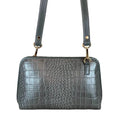 LeatherLuxe silver leather clutch and crossbody bag with detachable shoulder strap, elegant metallic finish, and minimalist luxury design for evening and casual wear.