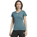 Person wearing a teal Adidas t-shirt and black shorts on a white background