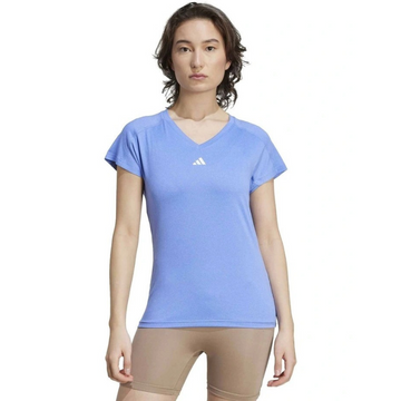 Person wearing a blue Adidas t-shirt on a white background