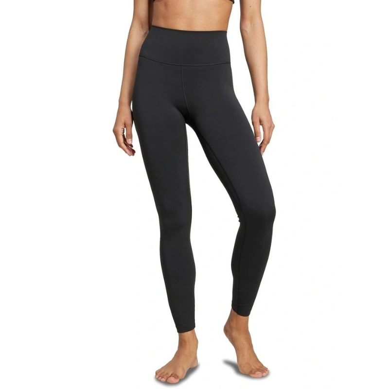 Person wearing black leggings on a white background