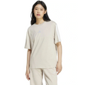Person wearing a beige t-shirt and pants on a white background