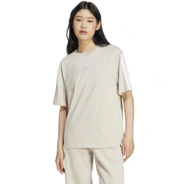 Person wearing a beige t-shirt and pants on a white background