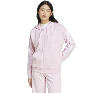 Person wearing a pink tracksuit on a white background