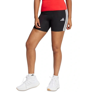 Person wearing black Adidas shorts with white stripes on a white background