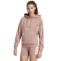 Woman wearing a pink Adidas hoodie and shorts on a white background