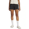 Person wearing black Adidas shorts on a white background