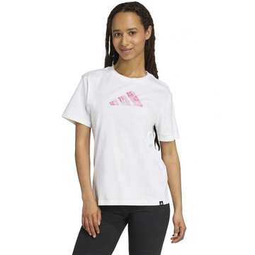 Person wearing a white t-shirt with pink graphics on a white background