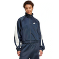 Person wearing a navy tracksuit with white sleeves on a white background