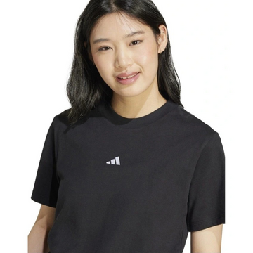 Person wearing a black Adidas t-shirt on a white background