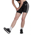 Person wearing black Adidas shorts with white stripes on a white background