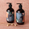 Two Sukin hand care products on a pink background
