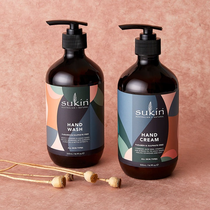 Two Sukin hand care products on a pink background