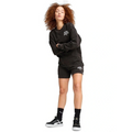 Person wearing a black hoodie and shorts set with visible branding on a white background