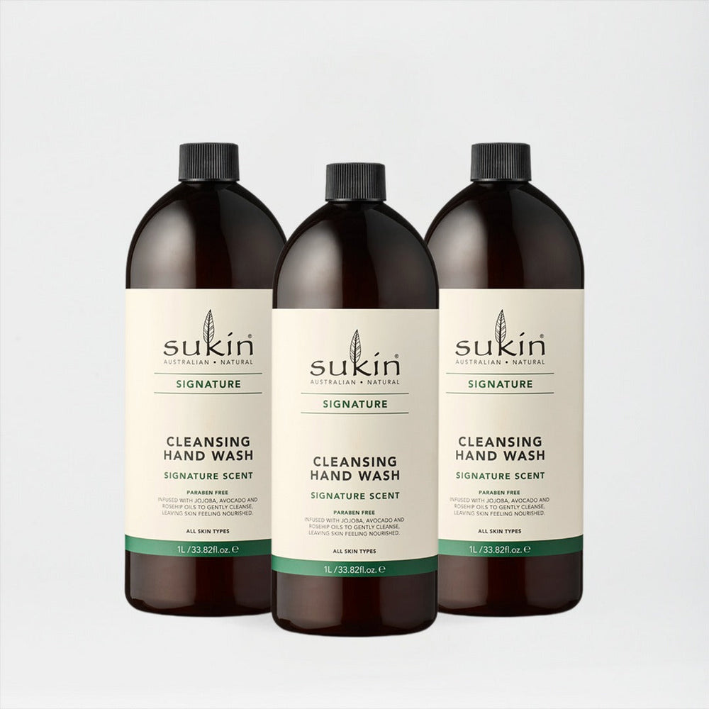 Three bottles of Sukin cleansing hand wash on a light gray background