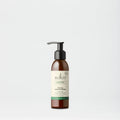 Sukin facial moisturizer bottle on a light gray background