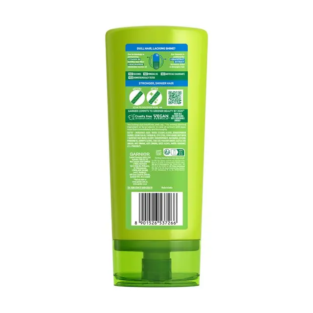 Green bottle with label on a white background