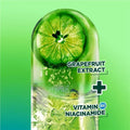 Grapefruit extract with vitamin B6 niacinamide on a green background