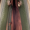 Elegant green leather office bag with detachable shoulder strap, ideal for professionals and business travel.