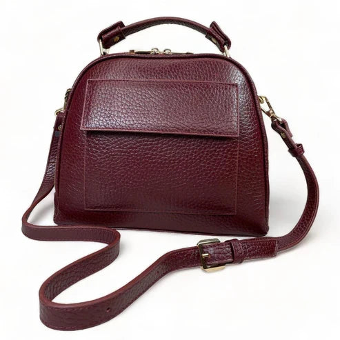 Elegant dark red genuine leather women’s satchel handbag with structured medium design and gold-tone accents — perfect for everyday and office wear.